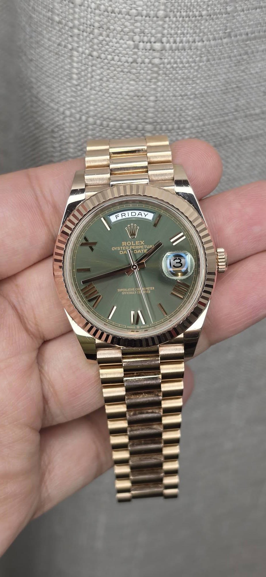 May be an image of wrist watch and text