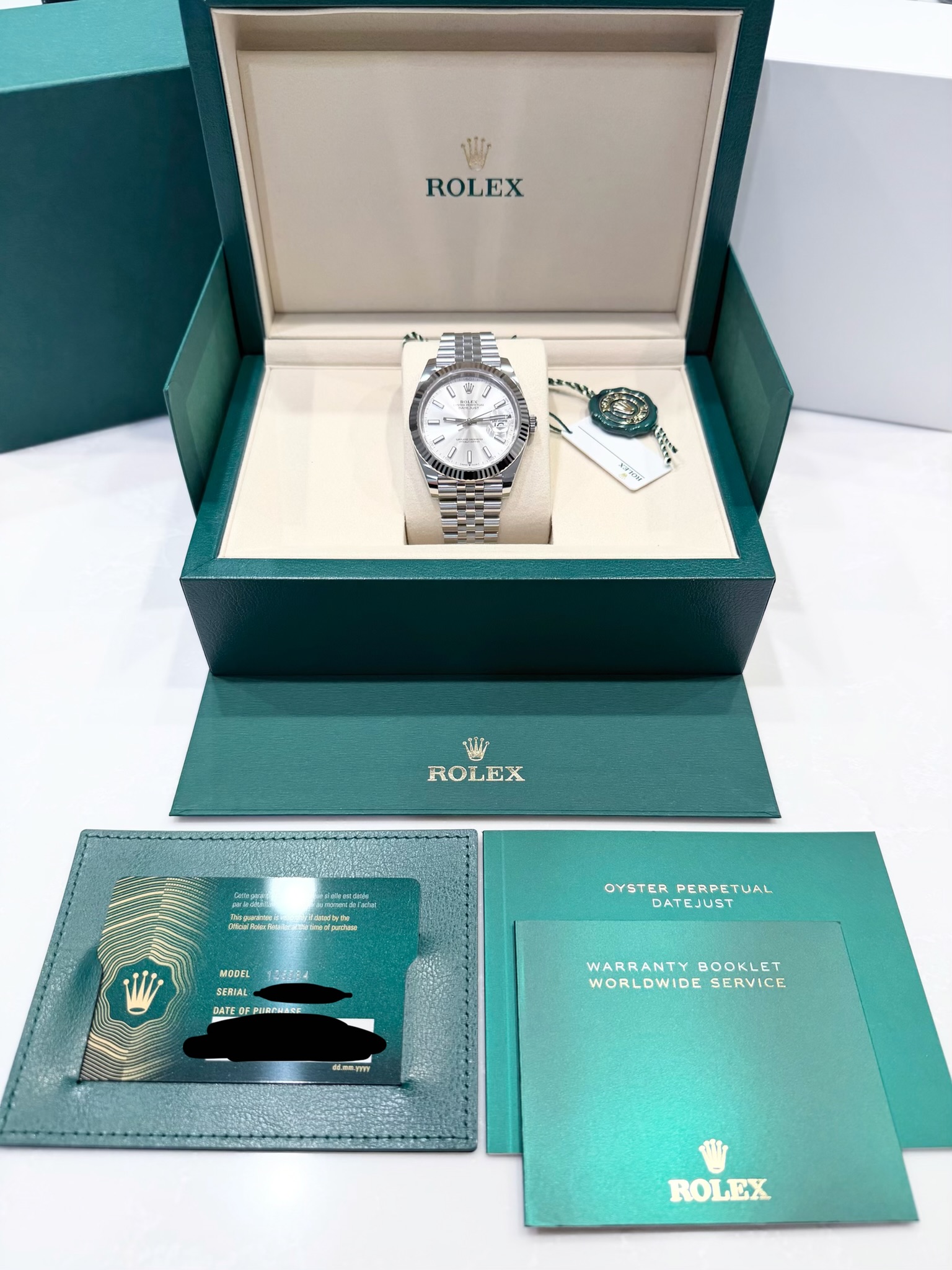 May be an image of wrist watch and text that says 'W ROLEX Y มกควิม WW ROLEX ስፈታ INATER dpusham MODEL SENIA SERIAL OYSTER OYSTERPERPETI PERPETUAL OYSTERPERPETUAL UAL DATEJUST t…