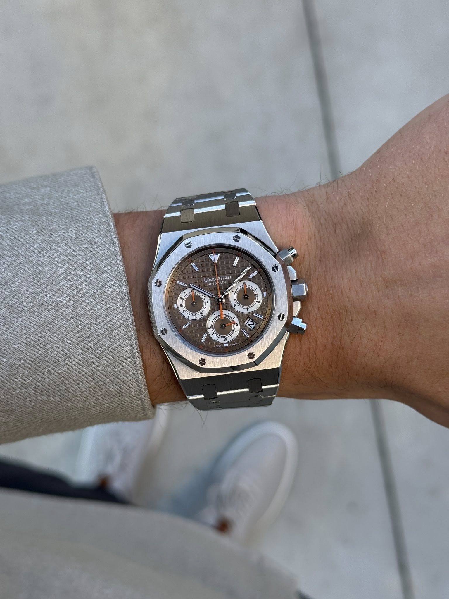May be an image of wrist watch and text