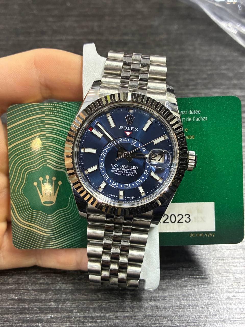 May be an image of wrist watch and text