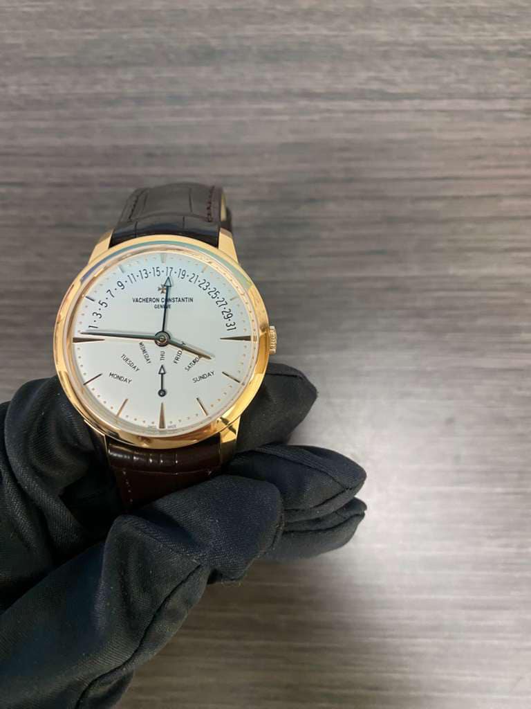 May be an image of wrist watch and text