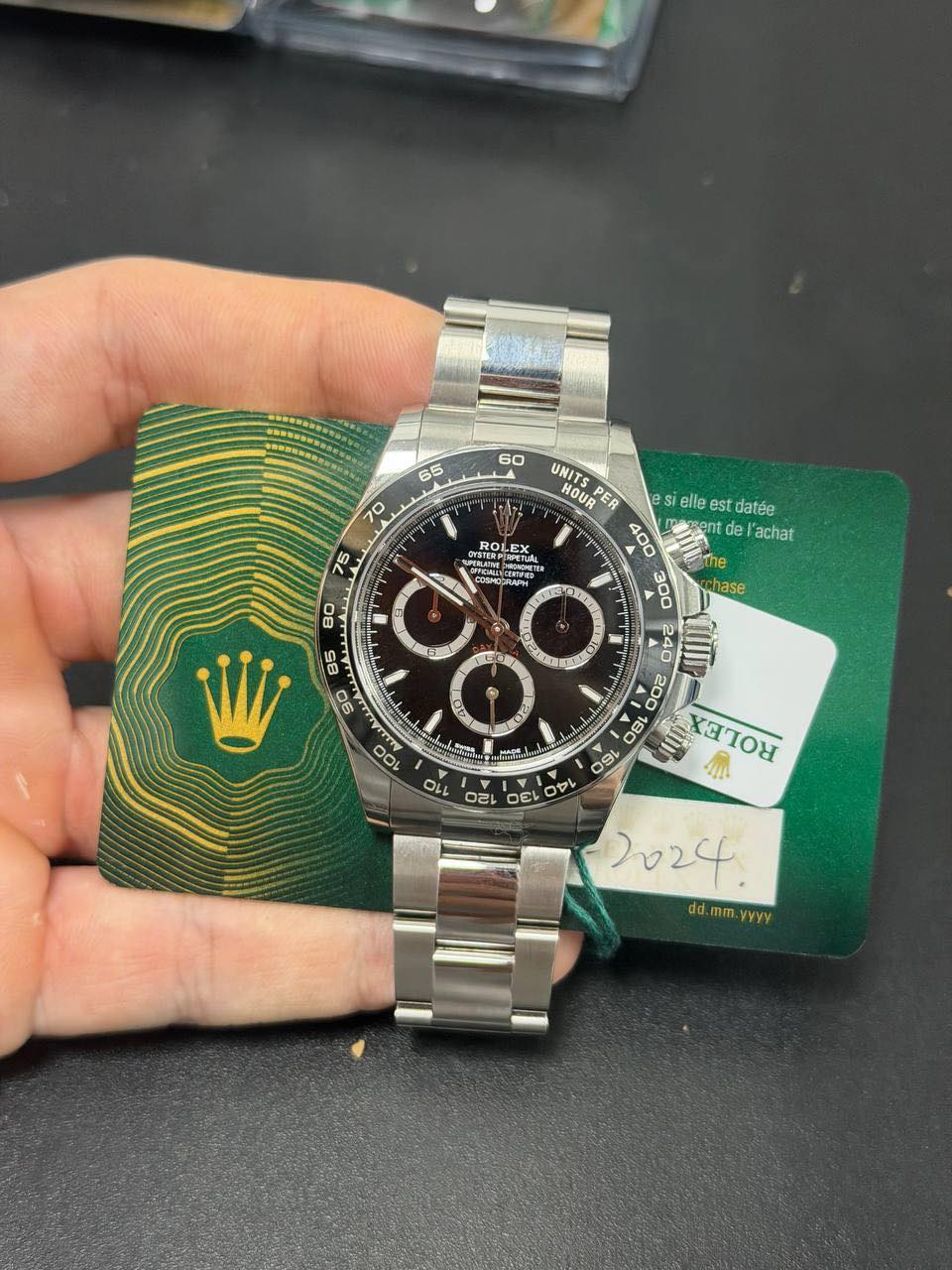 May be an image of wrist watch and text that says ' OYSTERYE ROLEX DEPPOCRLAPH 11 hase UNITS HOUR PER s elle est datée 400 40 de achat the SL ΧαΙOΥ 4 ល 円 A の O O P 110 2024.…