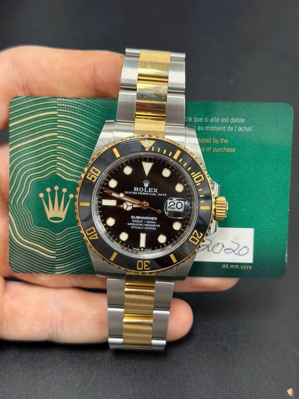 May be an image of wrist watch and text that says '含.-分旅 le que blequesielleestdatée SI elle est datée au moment aumamentdel'achat de achat Jated the of purchase 50 RO OLEX EX…