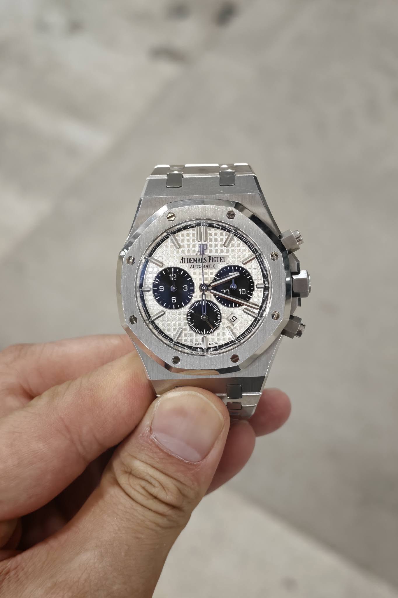 May be an image of wrist watch and text