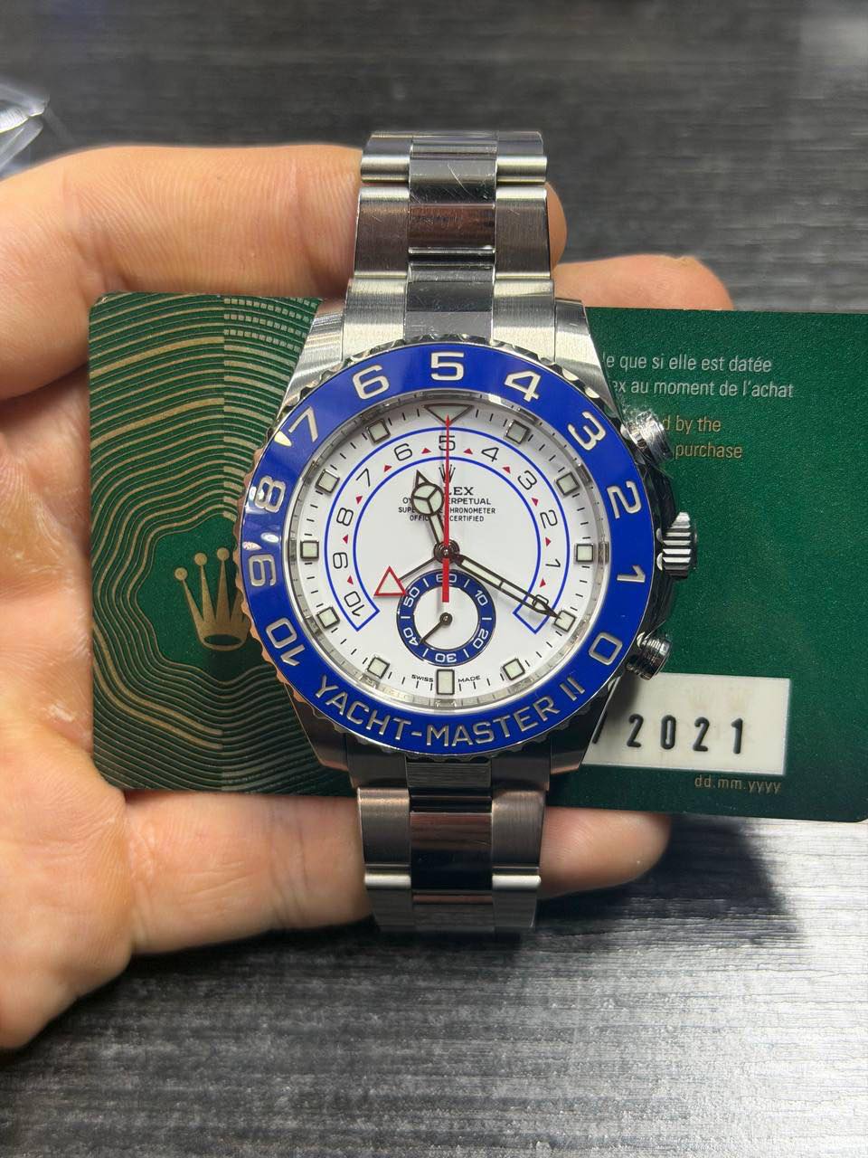 May be an image of wrist watch and text