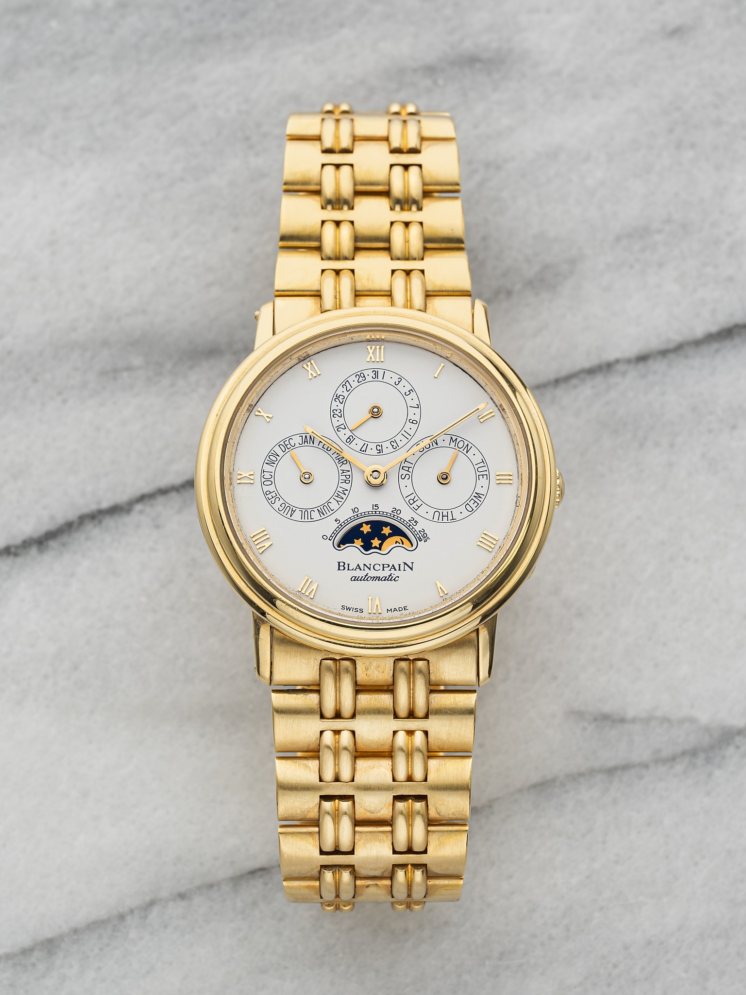 May be an image of jewelry, wrist watch and text
