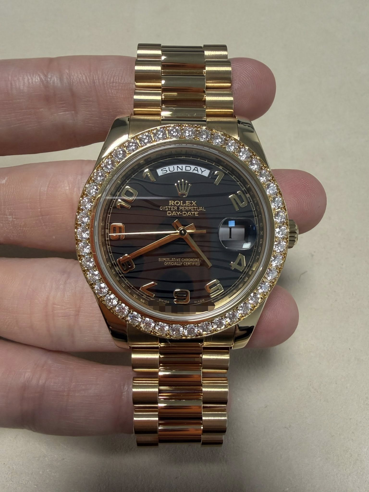 May be an image of wrist watch and text that says 'SUNDAY ROLEX'
