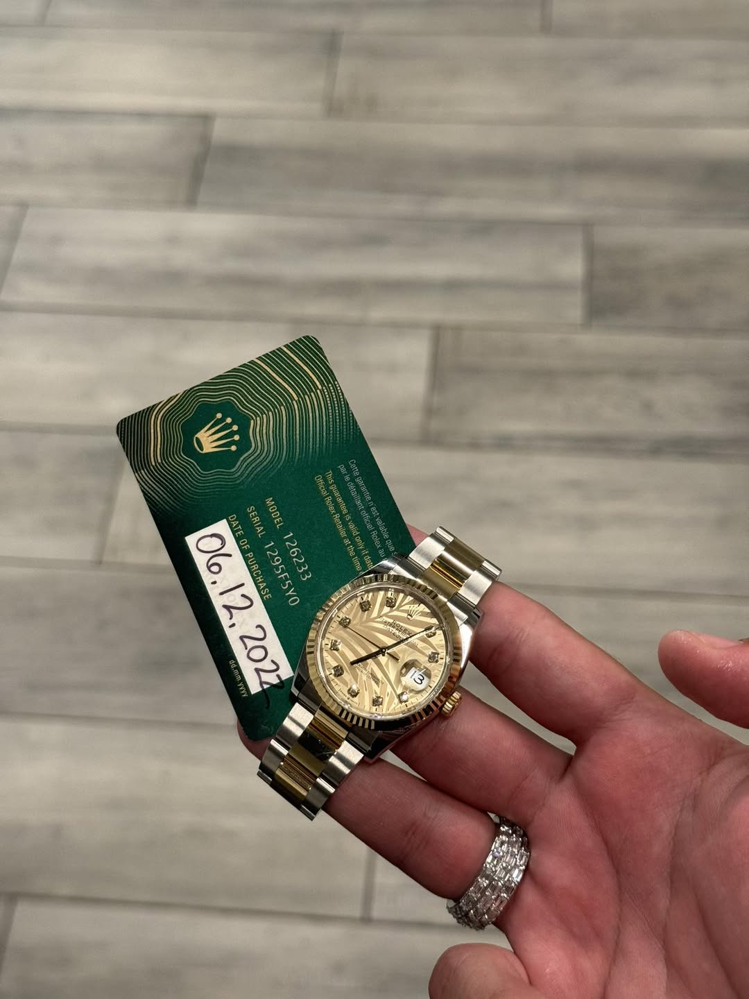 May be an image of wrist watch and text