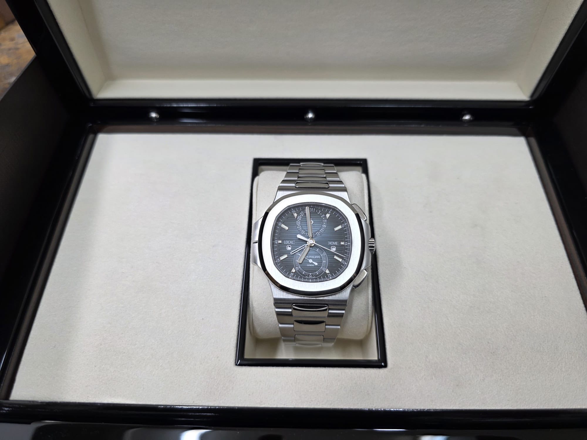 May be an image of wrist watch and text