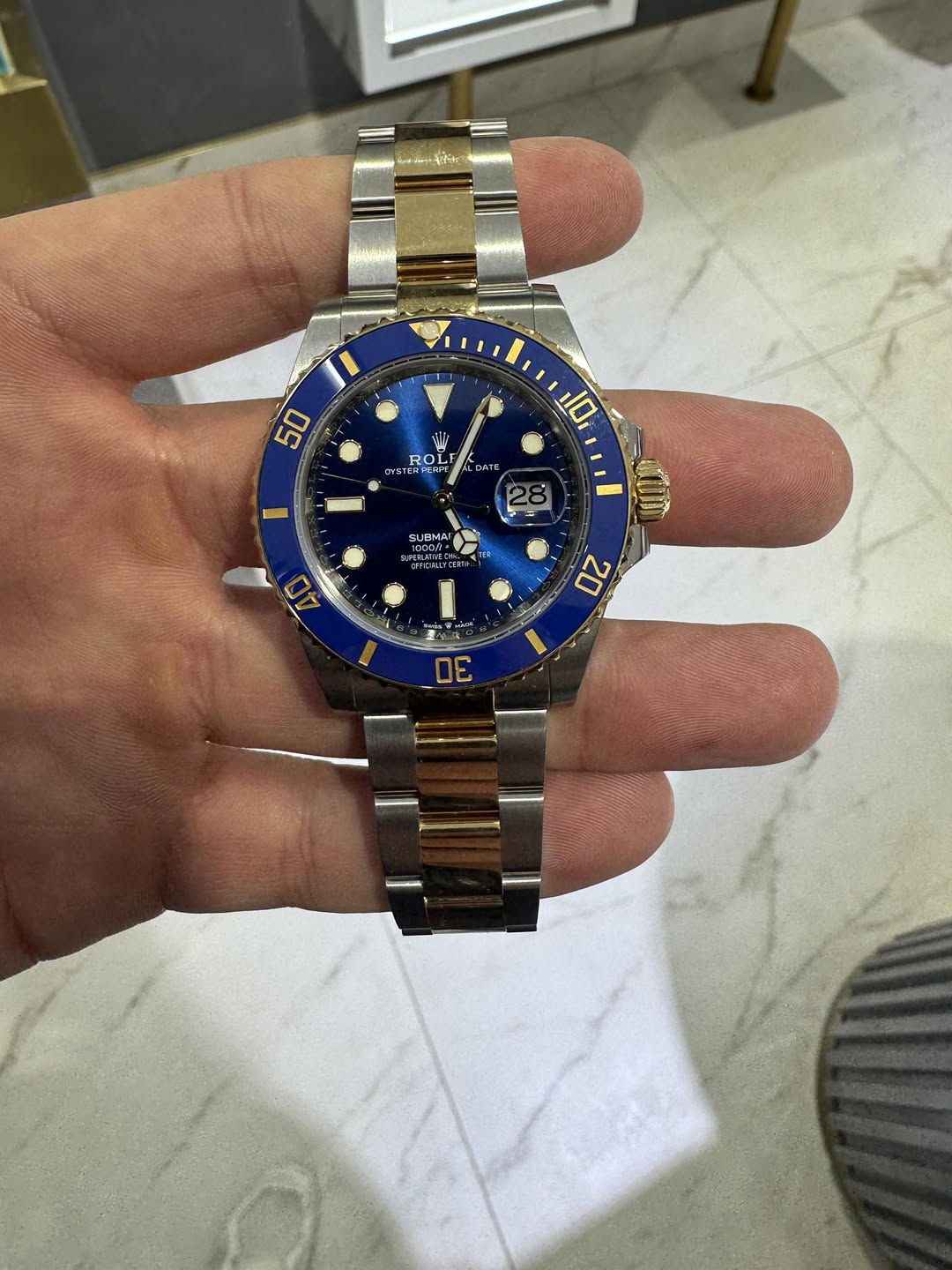 May be an image of wrist watch and text