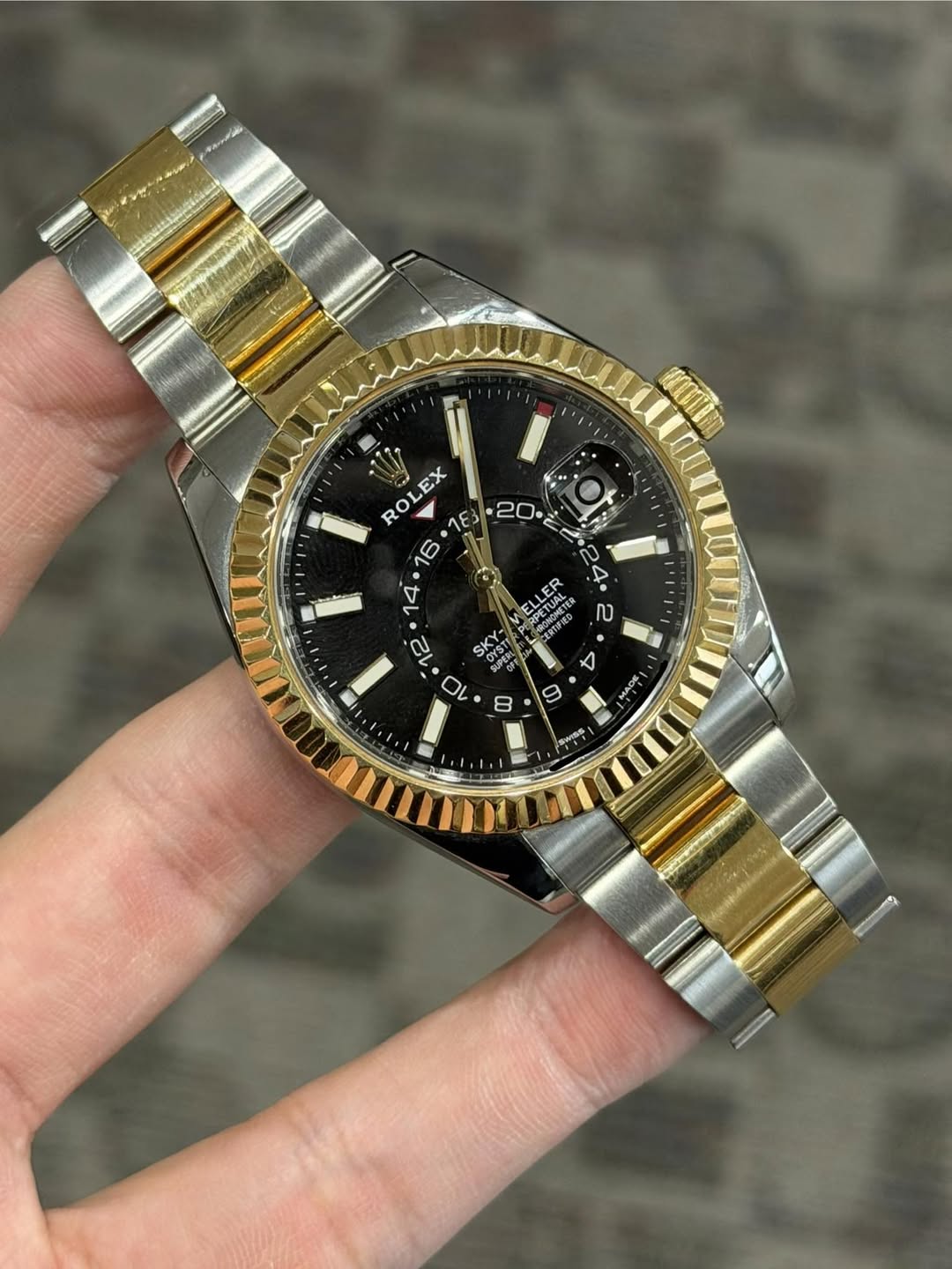 May be an image of wrist watch and text