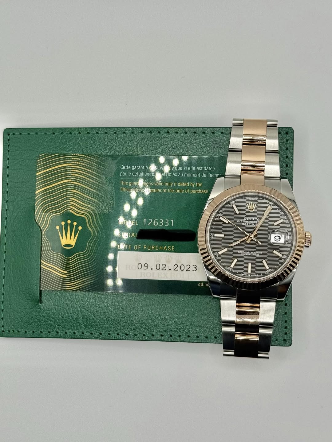 May be an image of wrist watch and text
