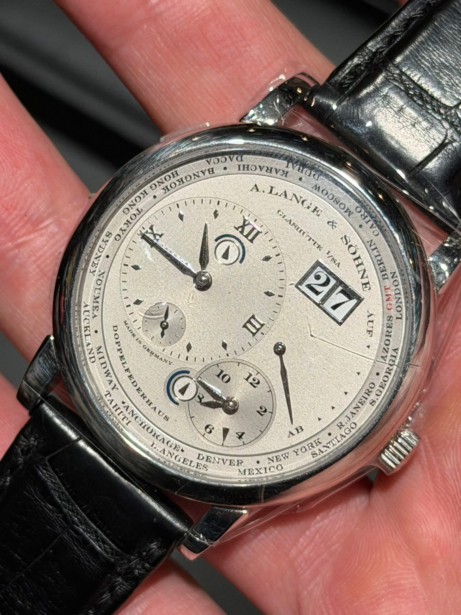 May be an image of wrist watch and text