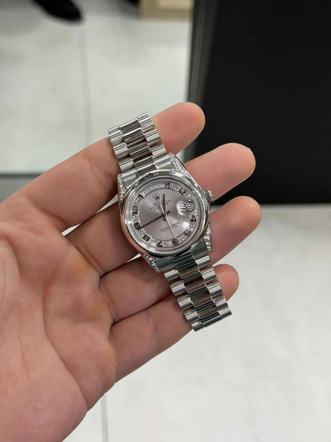 May be an image of wrist watch and text