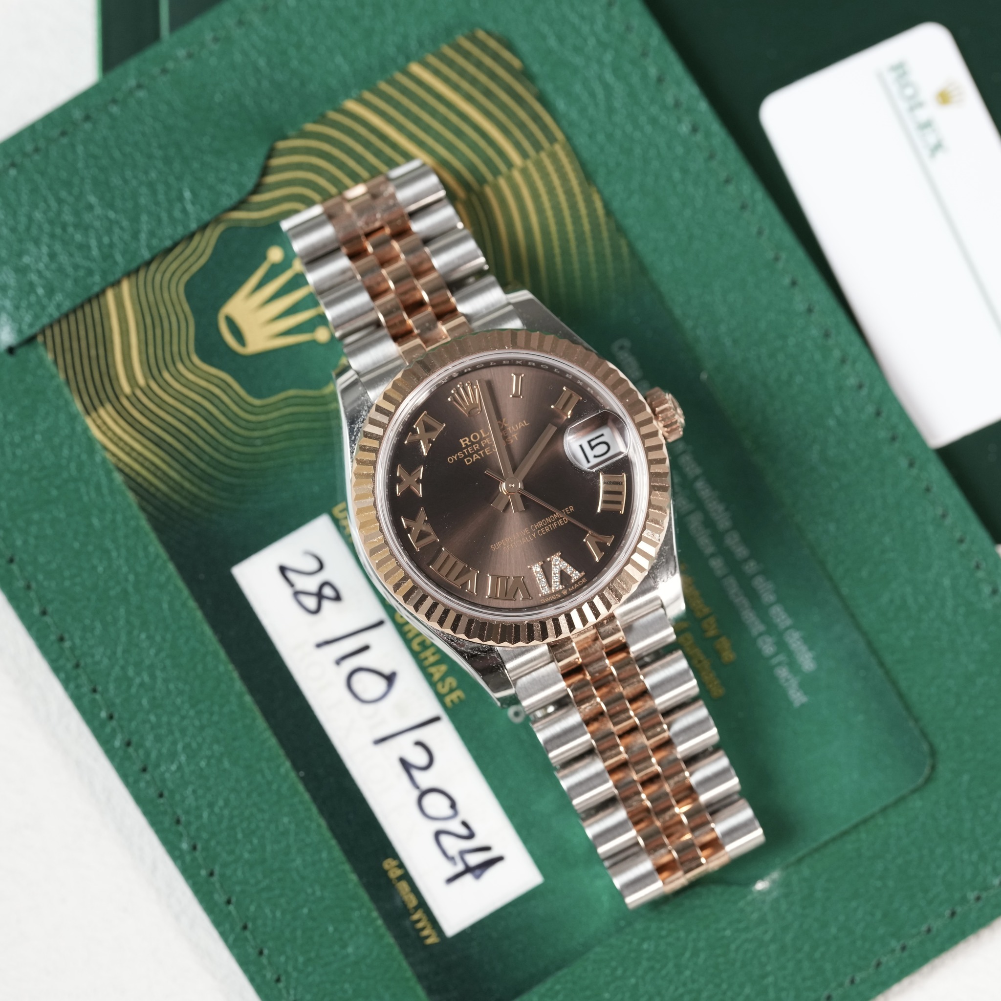 May be an image of wrist watch and text