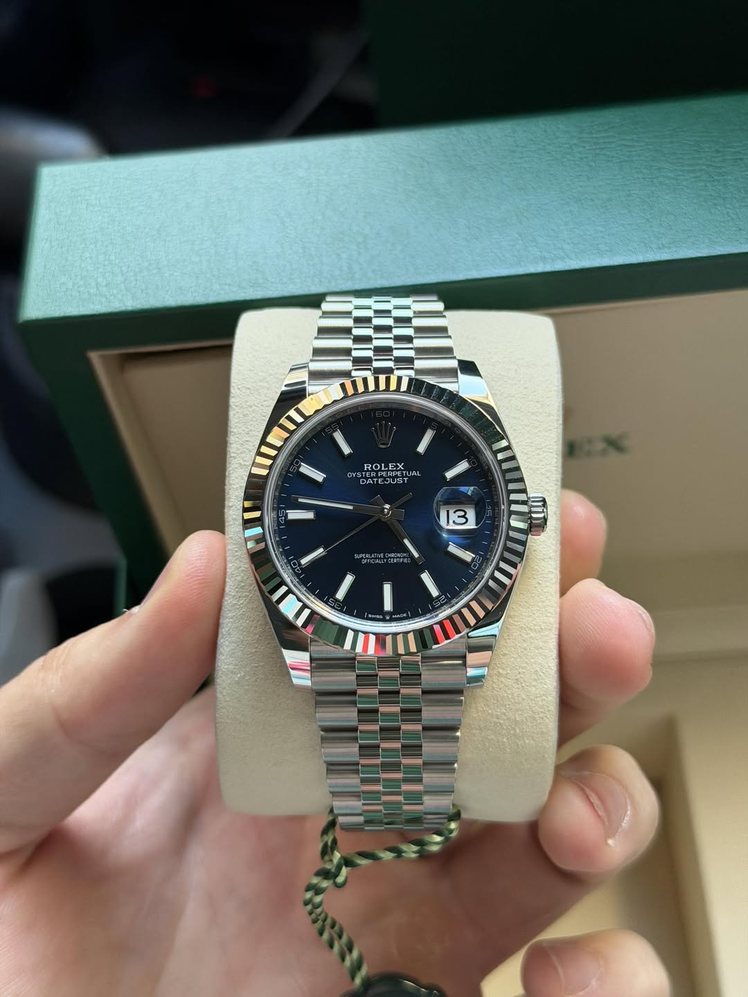 May be an image of wrist watch and text