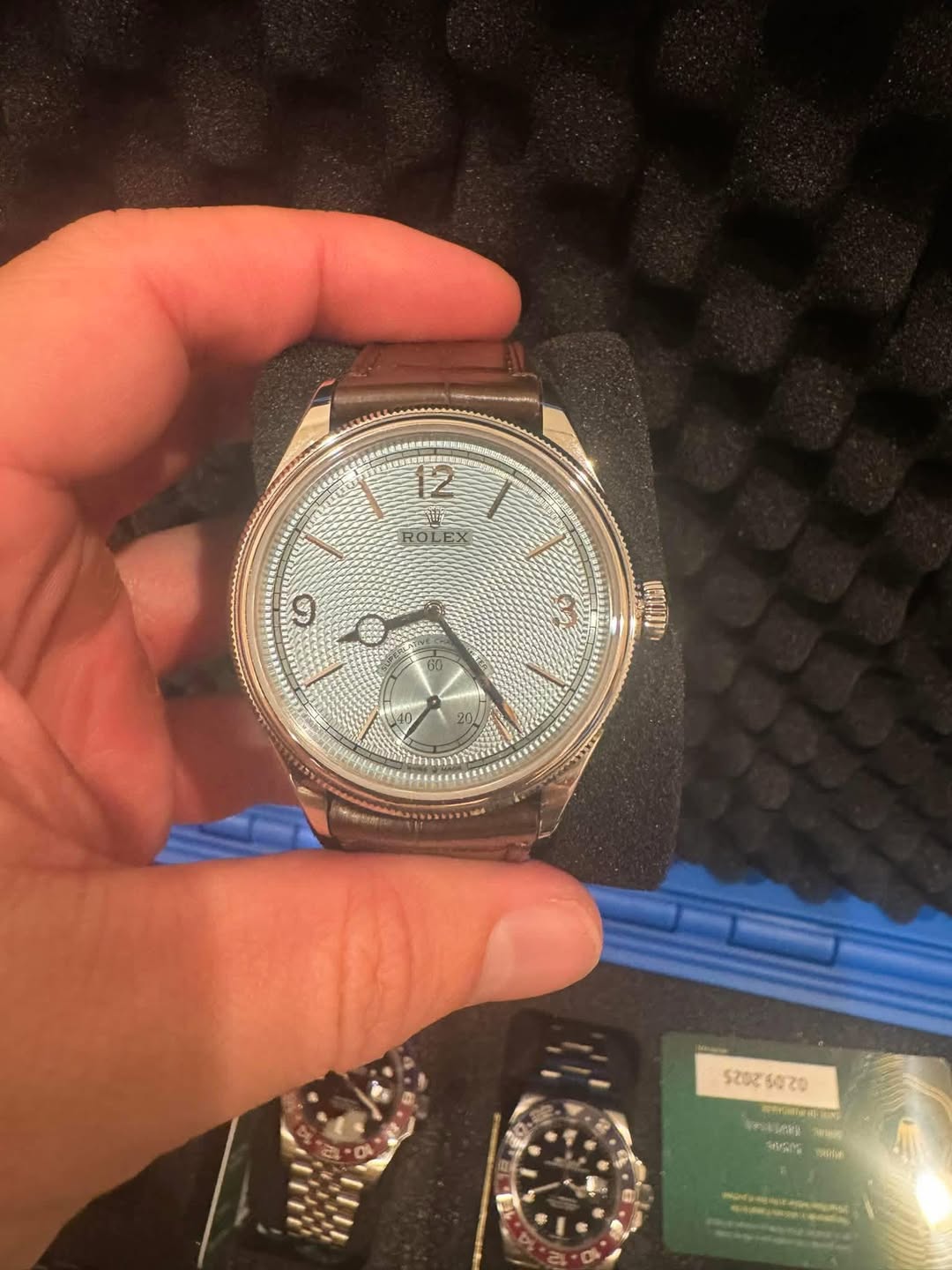 May be an image of wrist watch and text