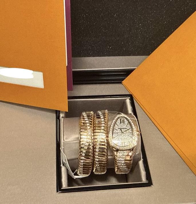 May be an image of wrist watch, jewelry and text