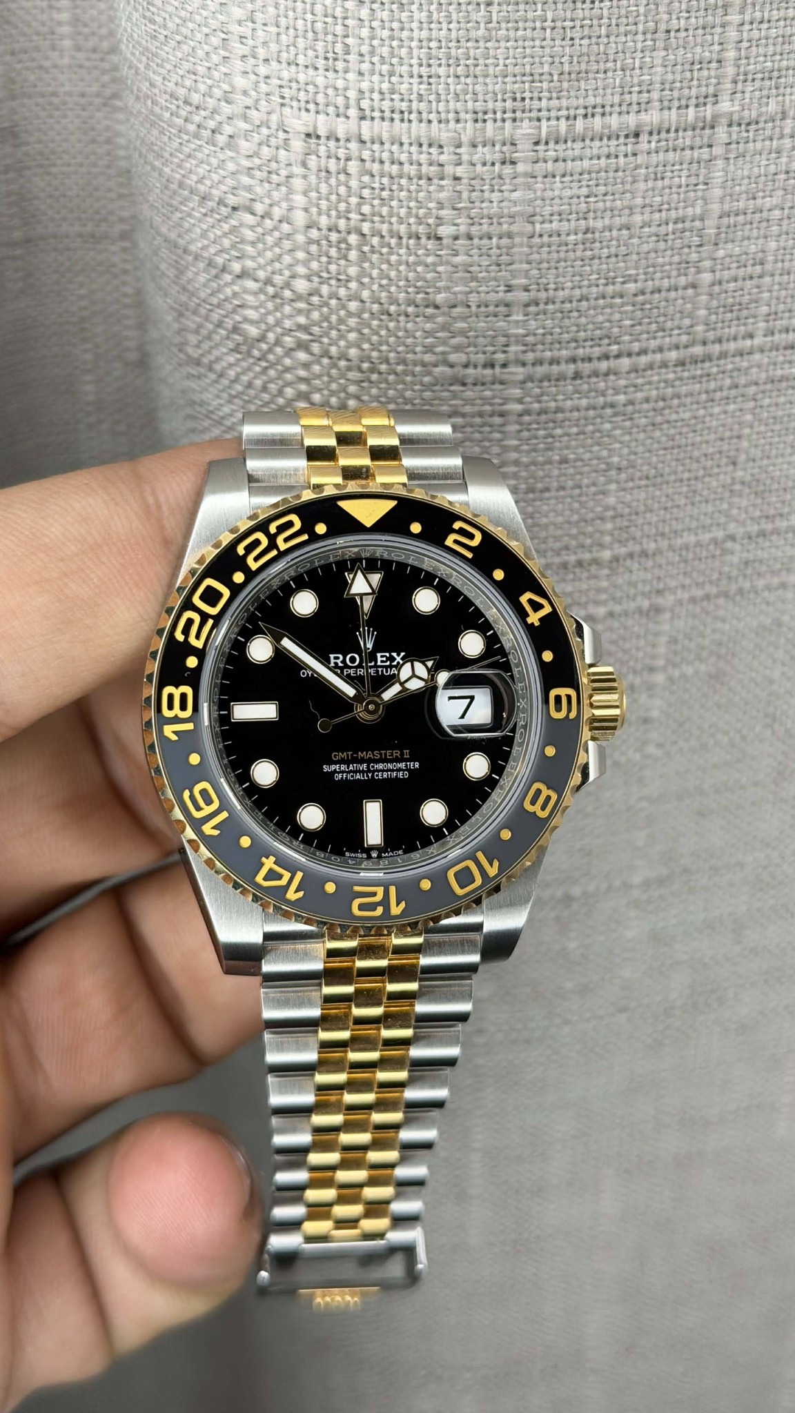 May be an image of wrist watch and text