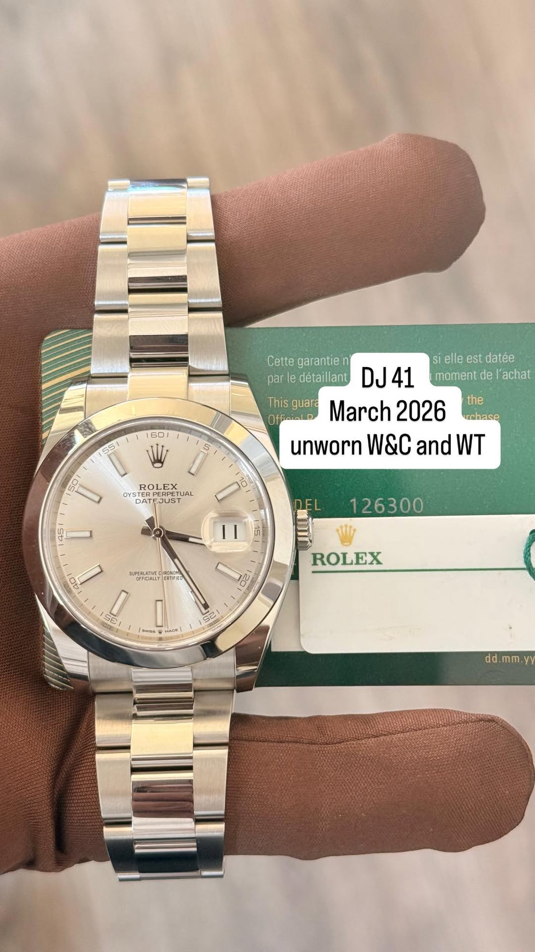 May be an image of wrist watch and text that says 'This guar Offialo S5 וב W Cette garantie détaillant DJ DJ41 41 elle est datée moment de l'achat March 2026 the echase unworn…