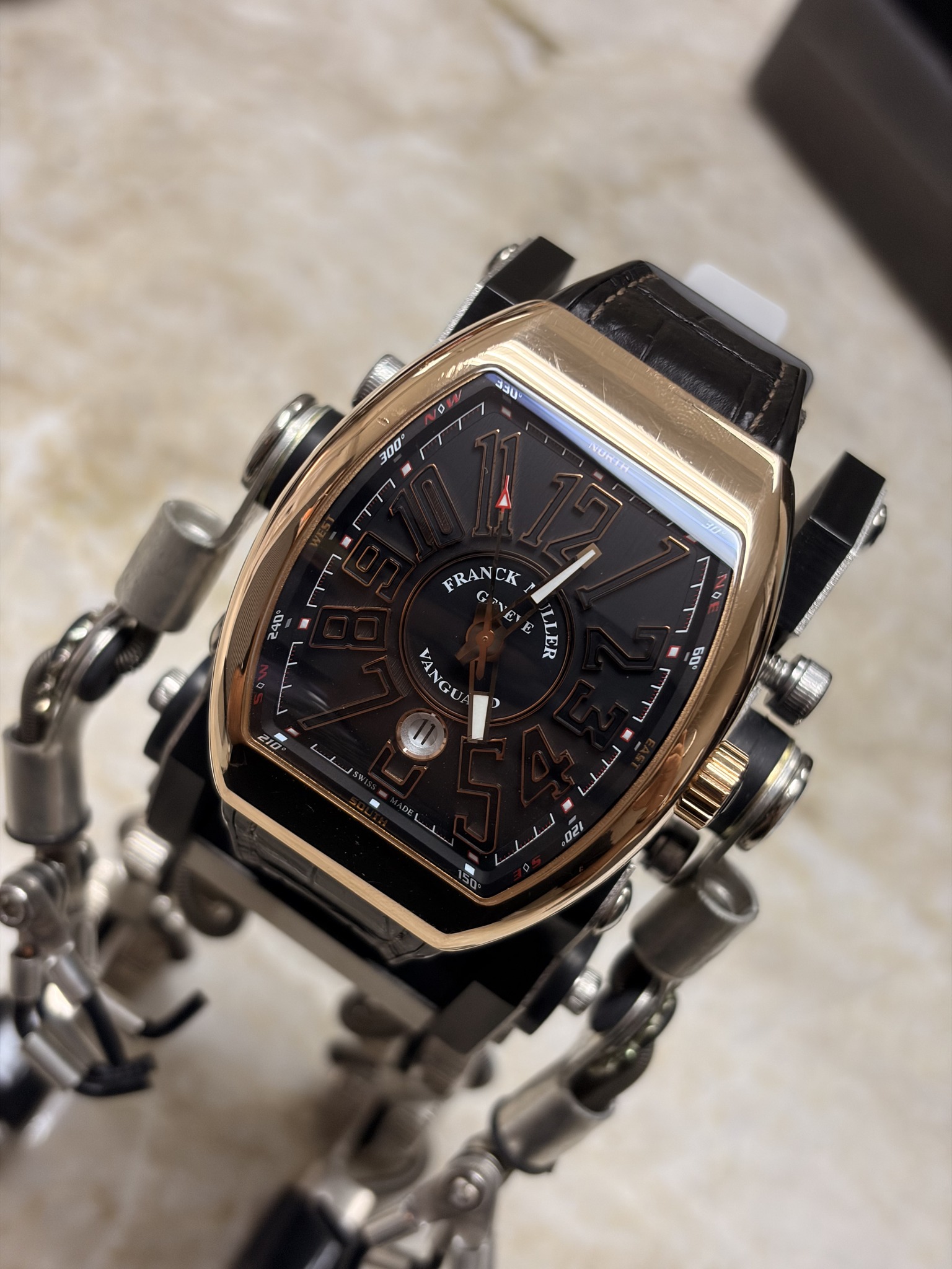 May be an image of wrist watch and text