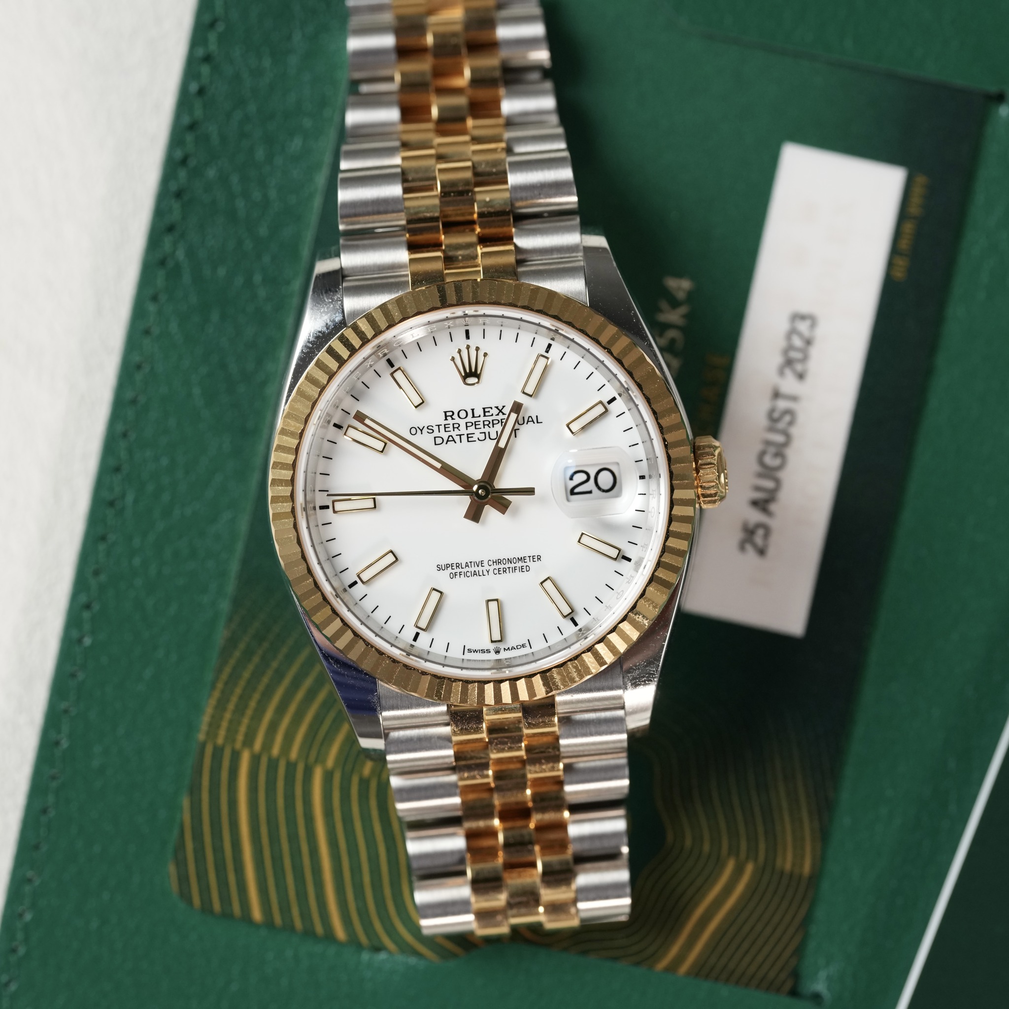 May be an image of wrist watch and text
