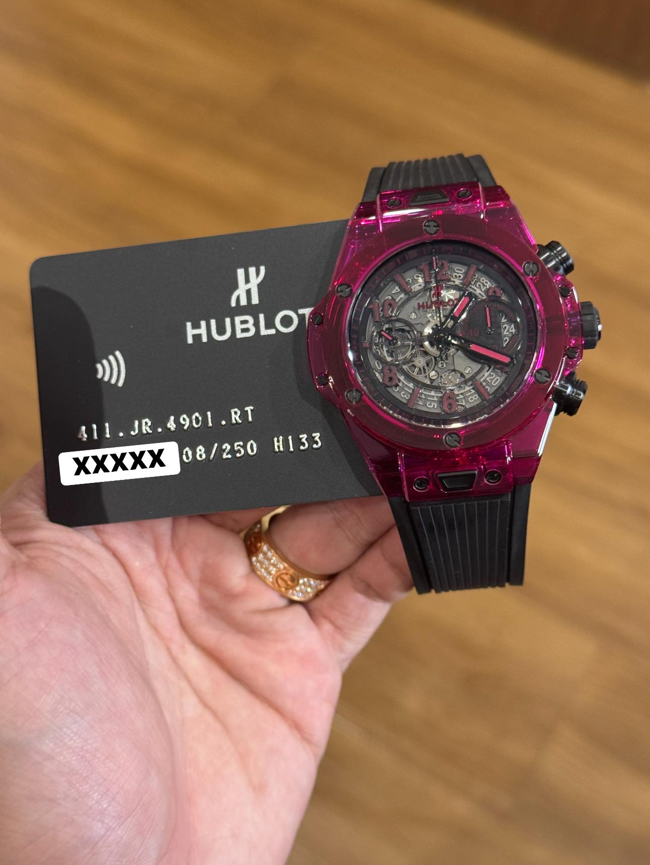 May be an image of digital watch and text that says 'e 30 ዞ HUBLOT R4 $11.JR.4901.RT 411. JR 411.JR. .RT .RT H133 XXXXX 08/250'