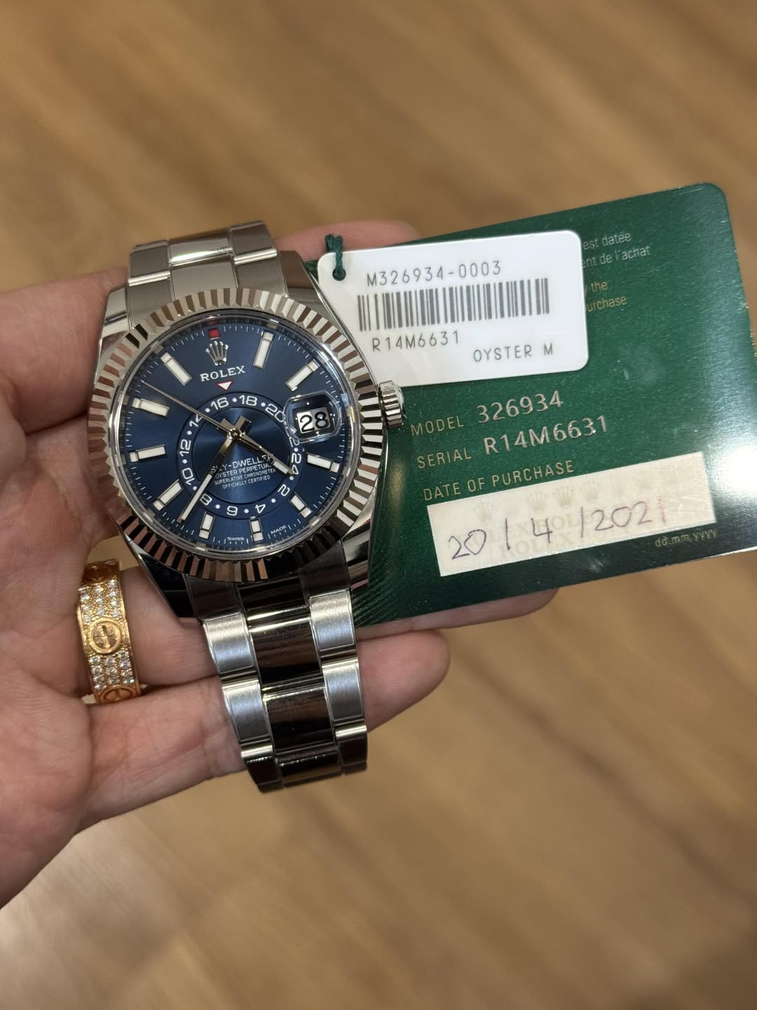 May be an image of wrist watch and text that says 'datee achat M326934-0003 ROLEX 16 R14M6631 OYSTER M -DNETUR לדהקום URARO MONE NETU JELTu GTU ល V MODEL 326934 SERIAL AL…