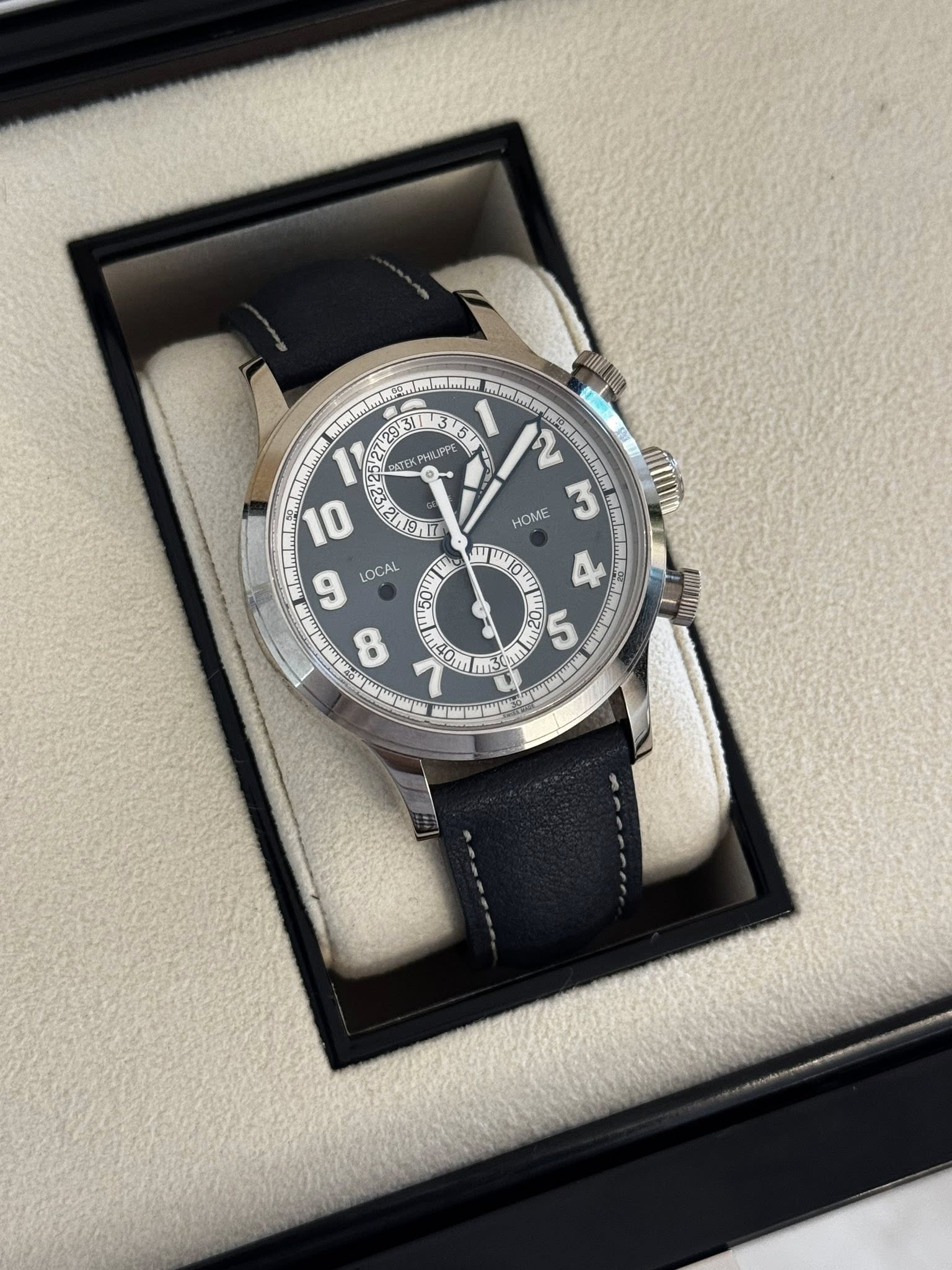 May be an image of wrist watch and text