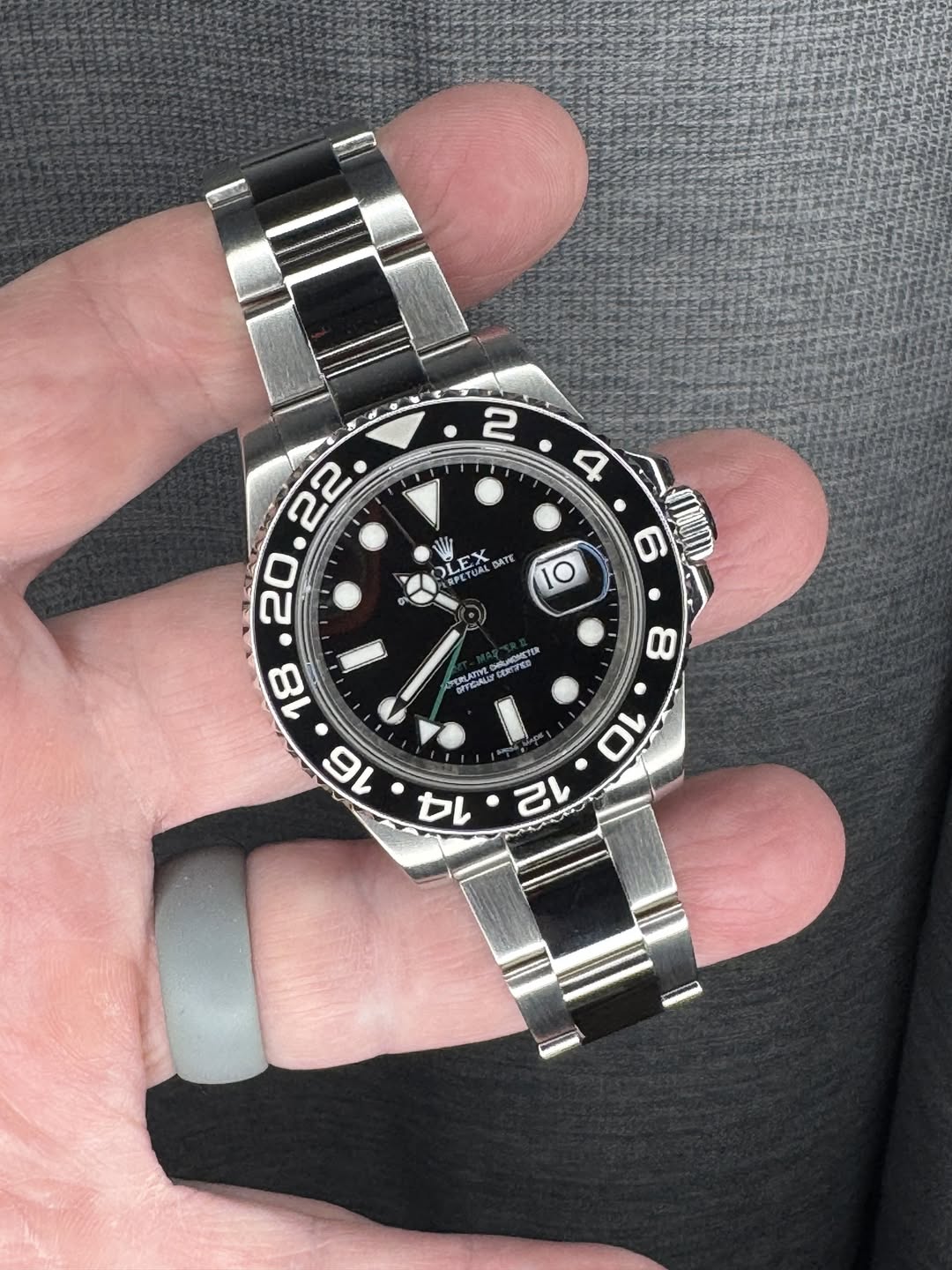 May be an image of wrist watch and text