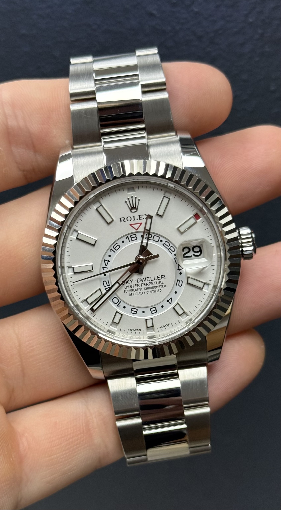 May be an image of wrist watch and text