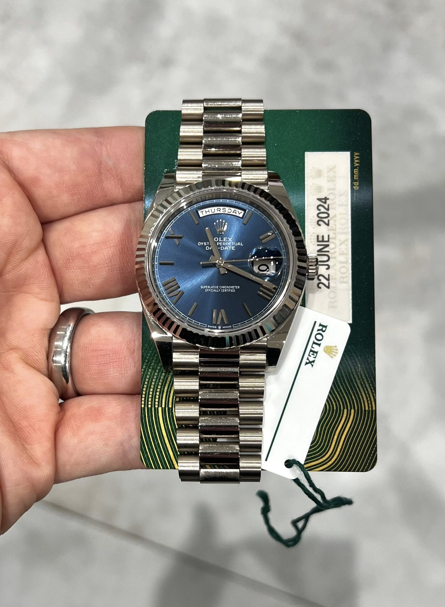May be an image of wrist watch and text