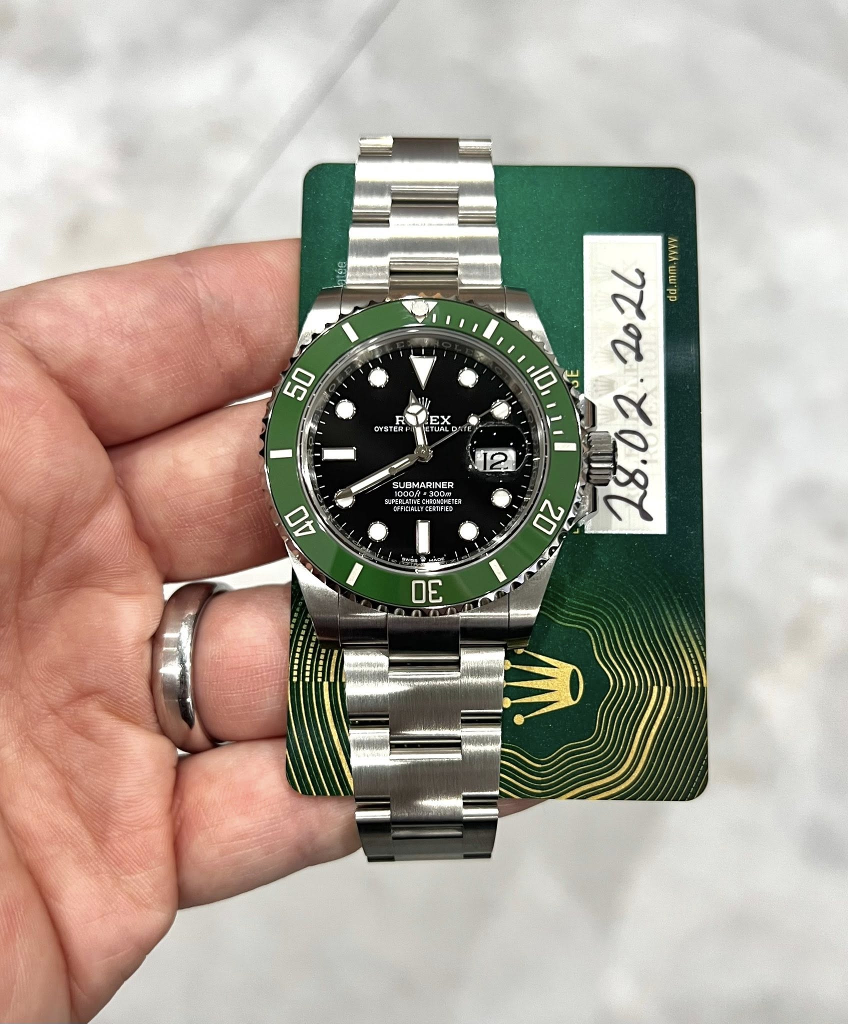 May be an image of wrist watch and text