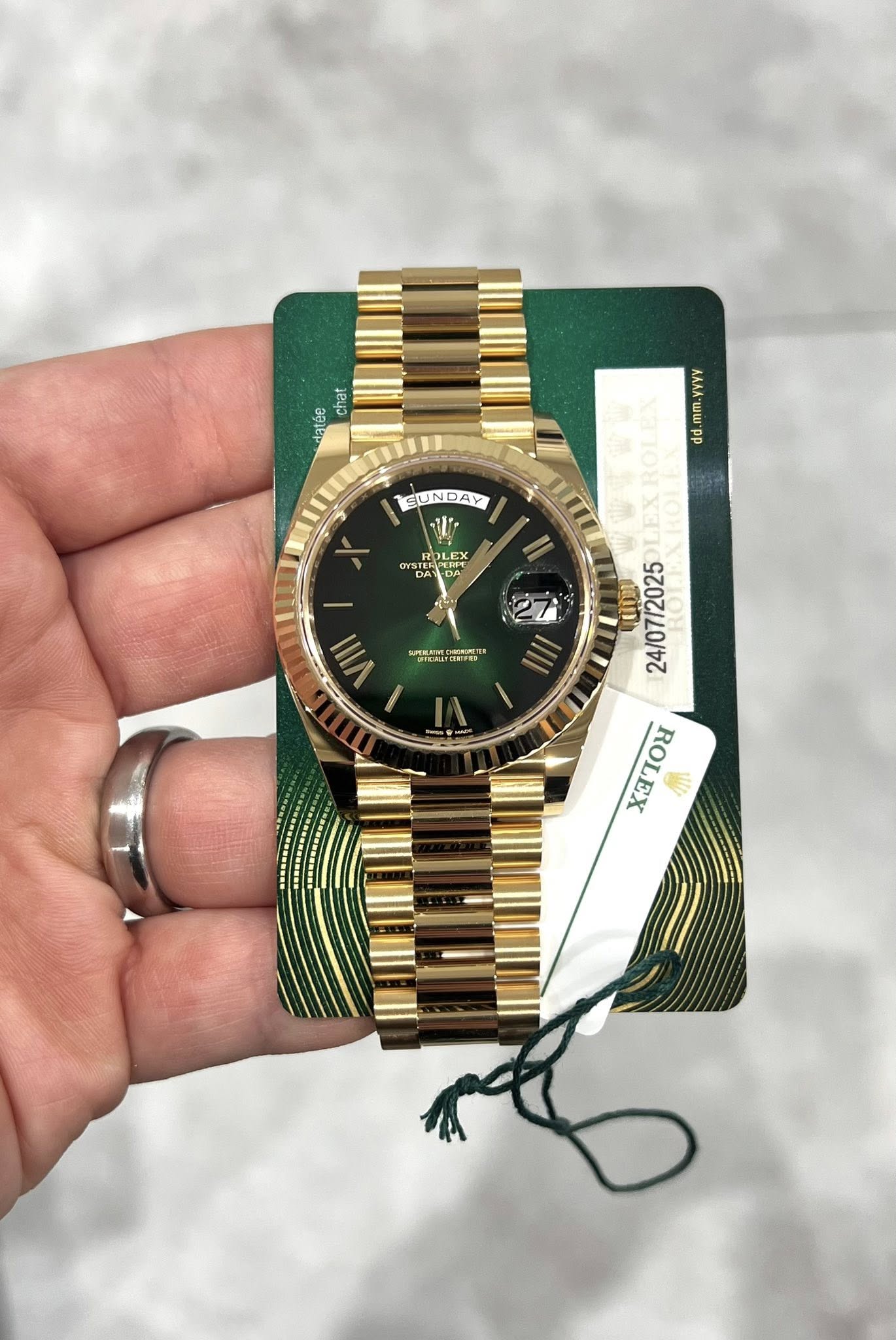 May be an image of wrist watch and text