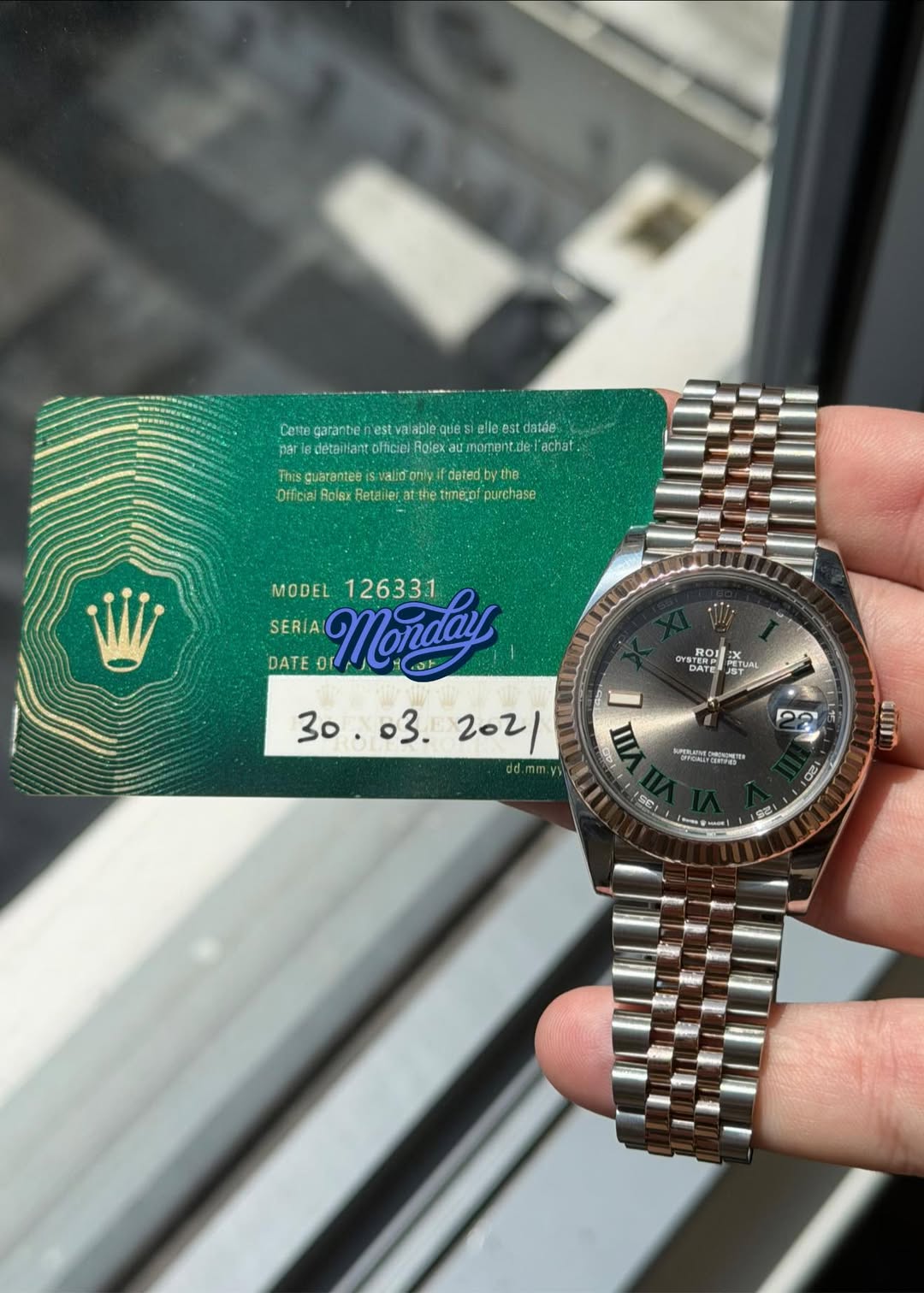 May be an image of wrist watch and text