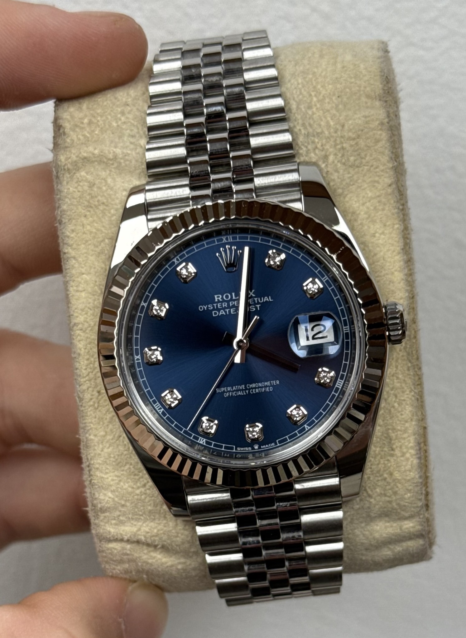 May be an image of wrist watch and text