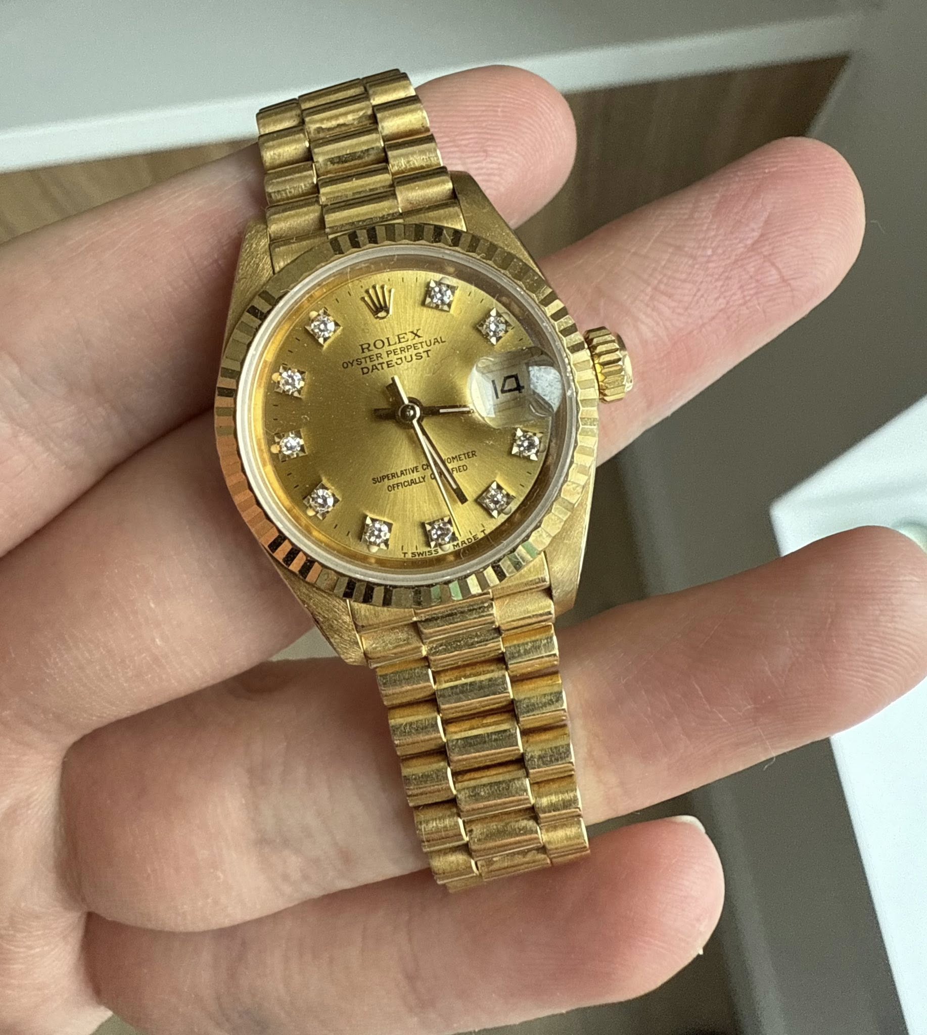 May be an image of wrist watch and text