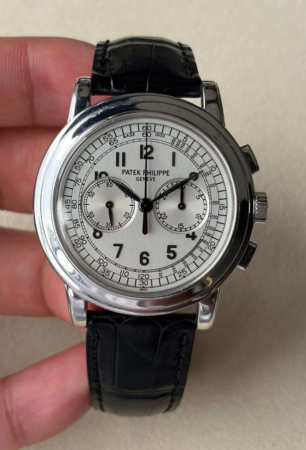 May be an image of wrist watch and text that says '55 មគ 65 BASE 60 1000 II 12 PATEK PATEKHILIPPE HILIPPE GEN VE 60 50 70 45TTT ° 98 00 I O 30 250 L C l00 09 ORO BO 5 0 6 20 HO 30…