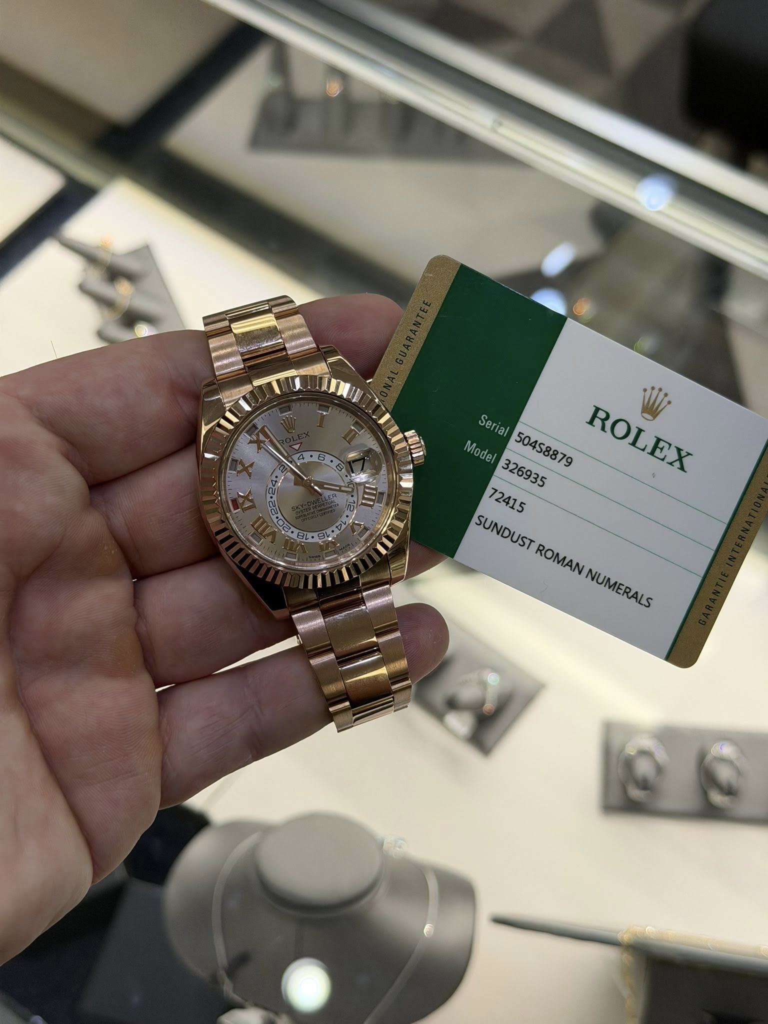 May be an image of wrist watch and text that says '4.G pp Serial 50458879 ROLEX W 326935 ROLEX 72415 SUNDUST ROMAN NUMERALS NUMERALS'