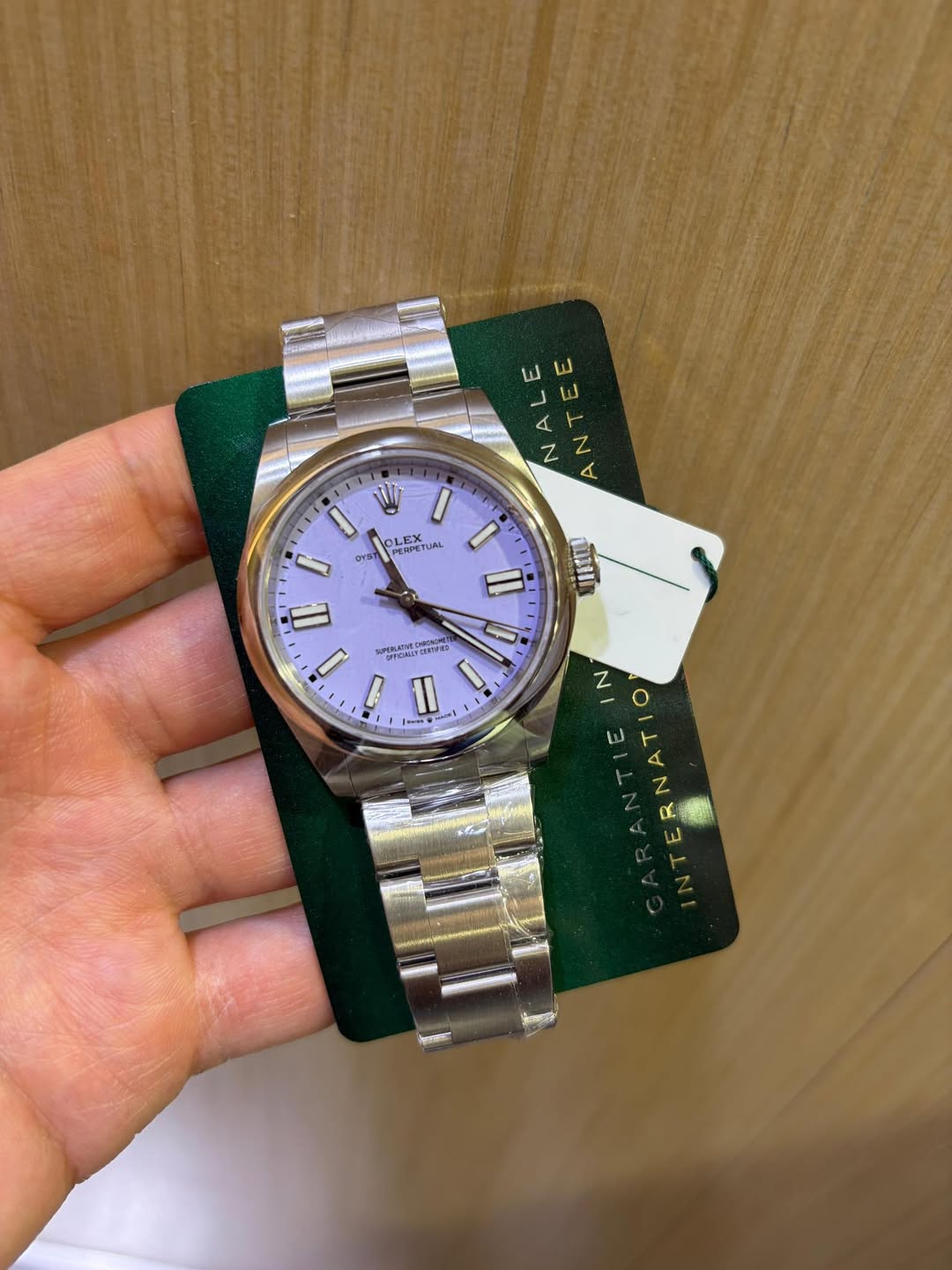 May be an image of wrist watch and text