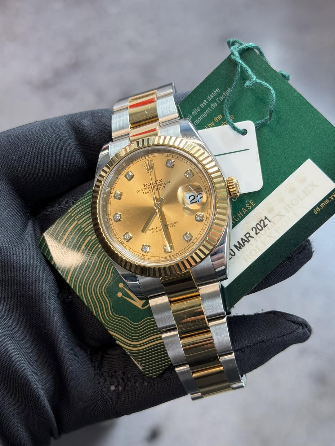 May be an image of wrist watch and text