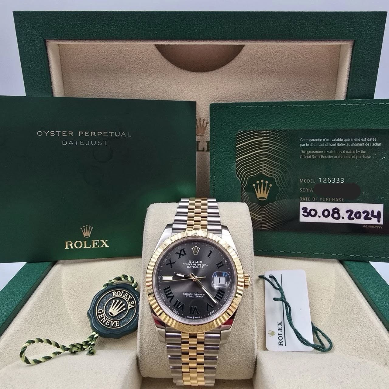 May be an image of wrist watch and text