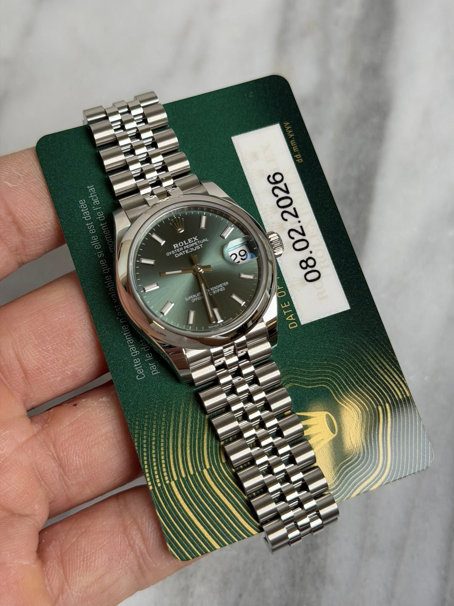 May be an image of wrist watch and text that says 'ROLEX . 影 8.02 02 VS OF I 1 E DAT OP Cettega'