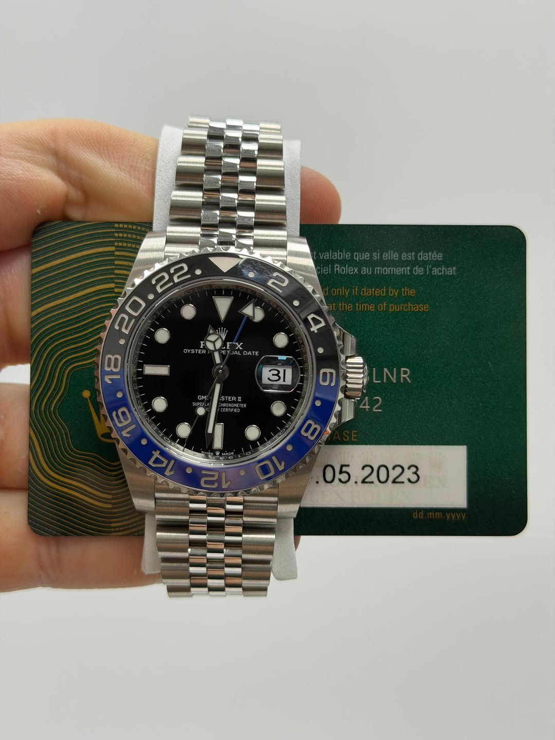 May be an image of wrist watch and text