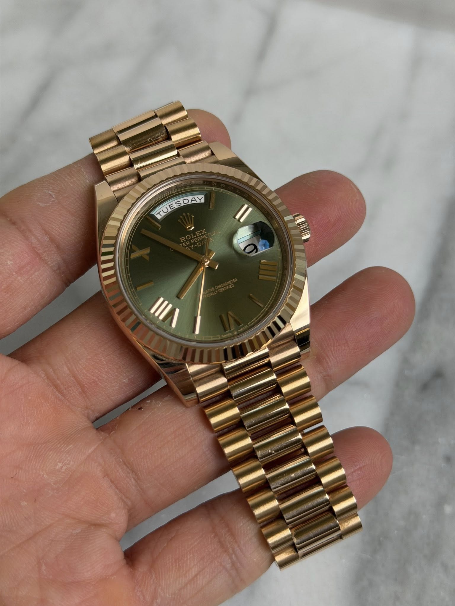 May be an image of wrist watch and text that says 'TUESDAY TUESDAY'