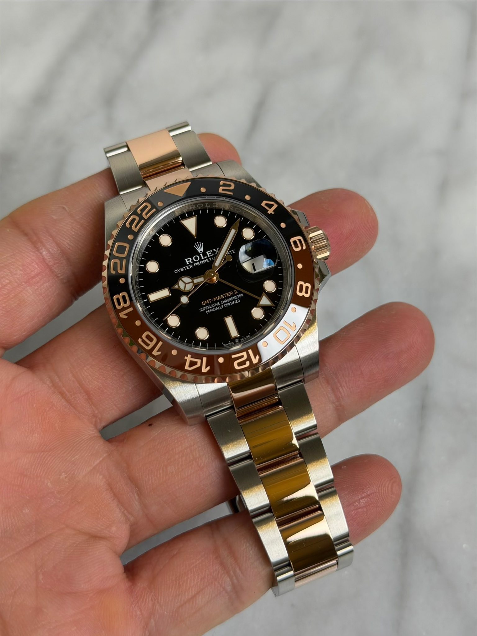 May be an image of wrist watch and text that says ' R ROLE W'