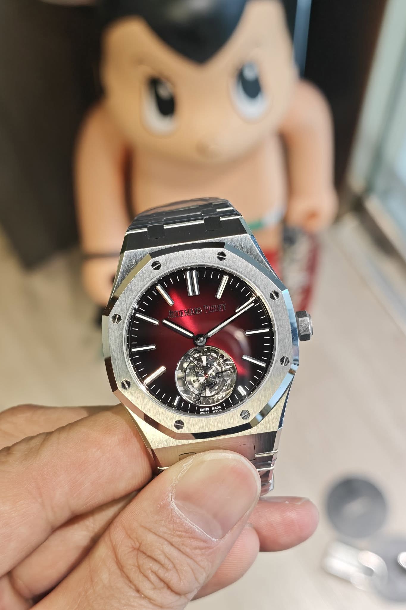 May be an image of wrist watch and text