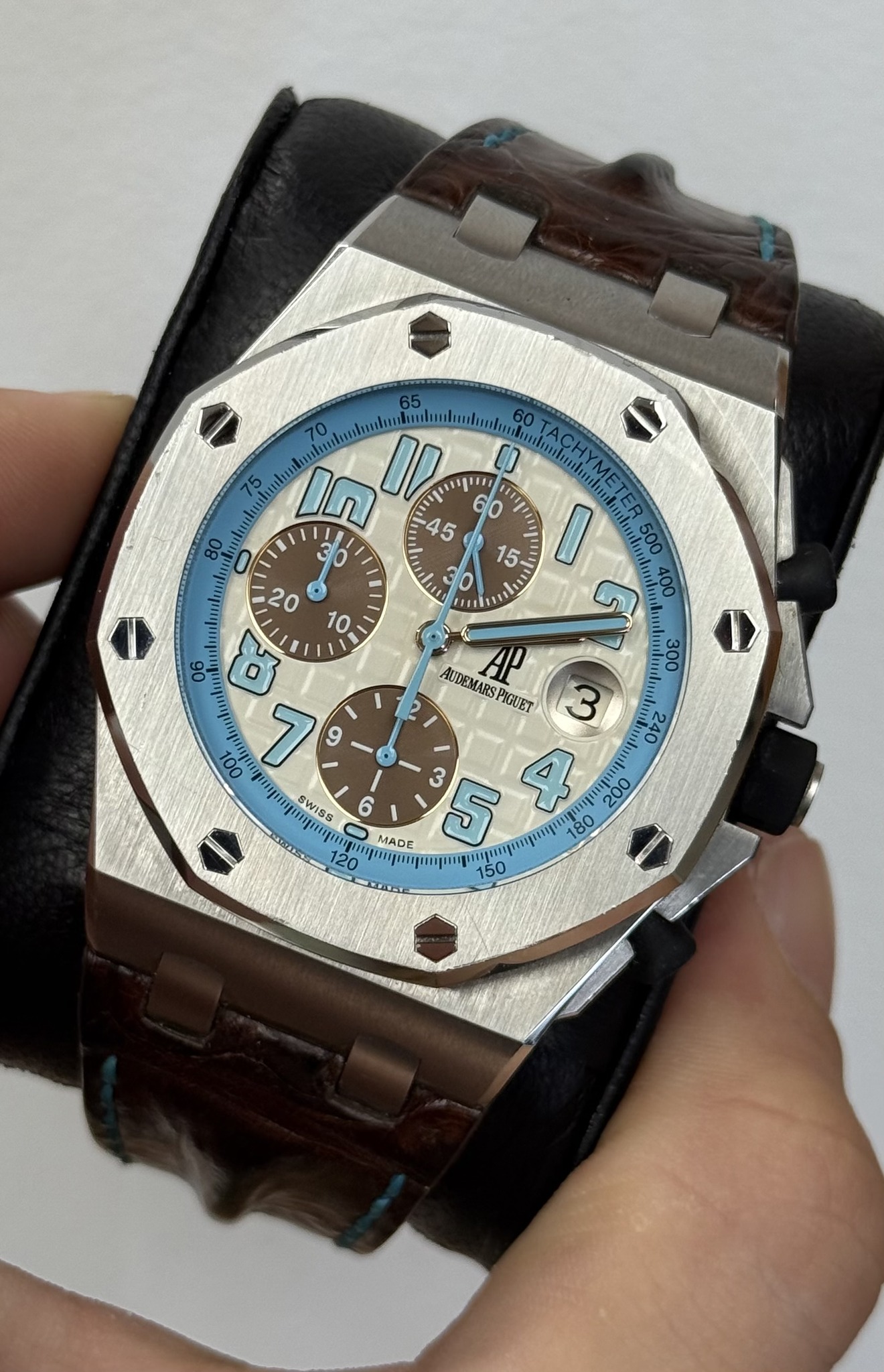 May be an image of wrist watch and text