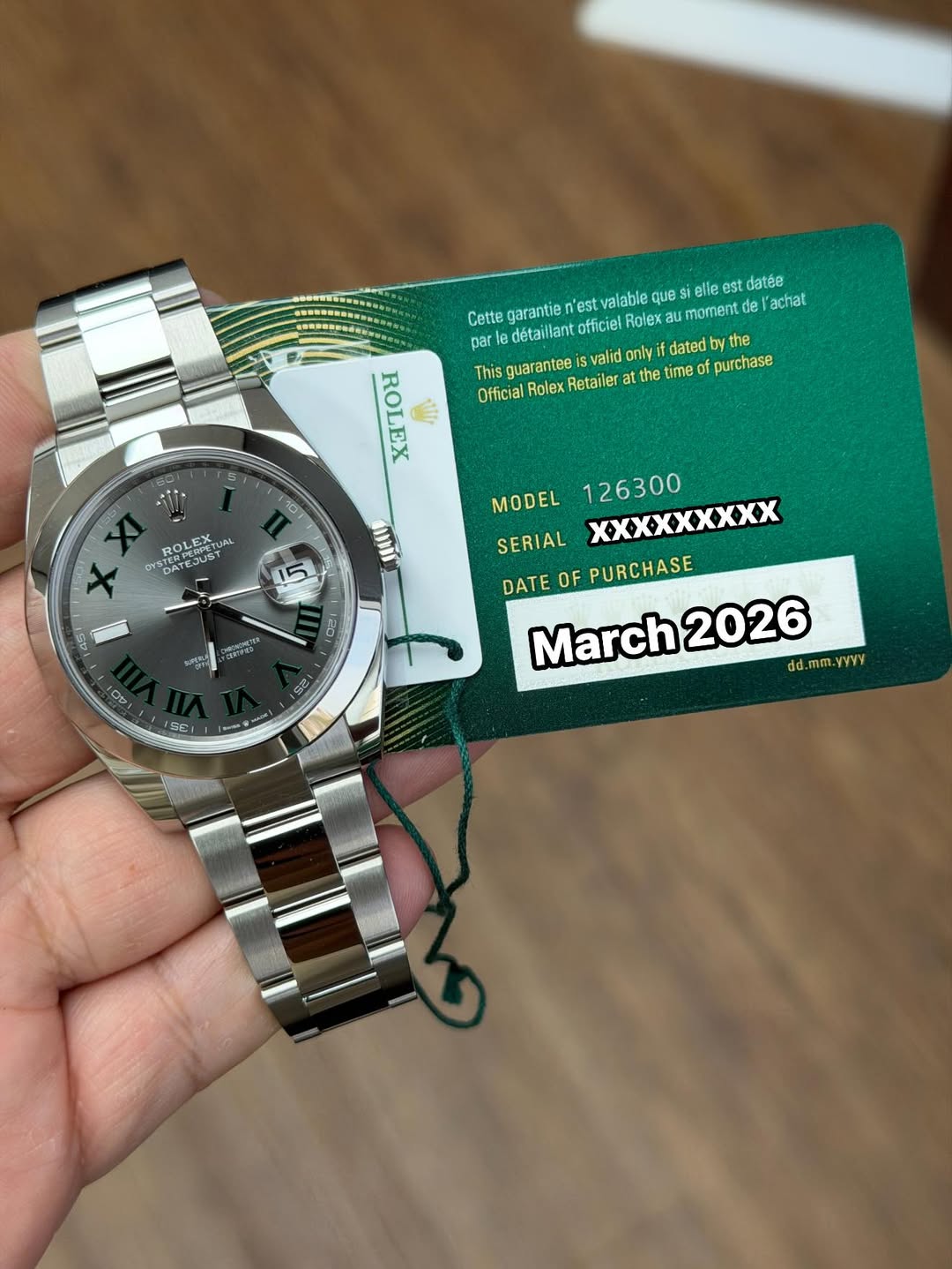May be an image of wrist watch and text that says 'garantie 'est vaiable ตุบ eli est st datés 'achat Cette détaillant officiel Role moment guarantee valid only dated dby the…