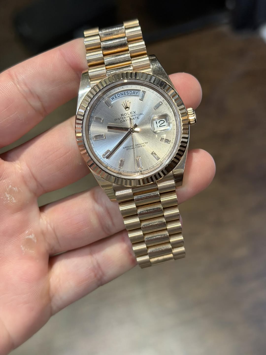 May be an image of wrist watch and text